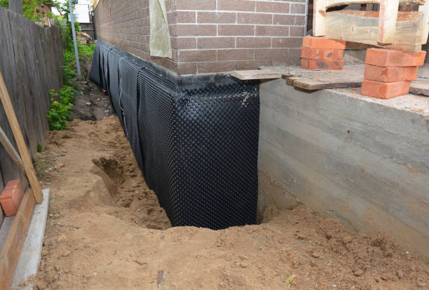Happy homeowners after waterproofing job in Wilmer